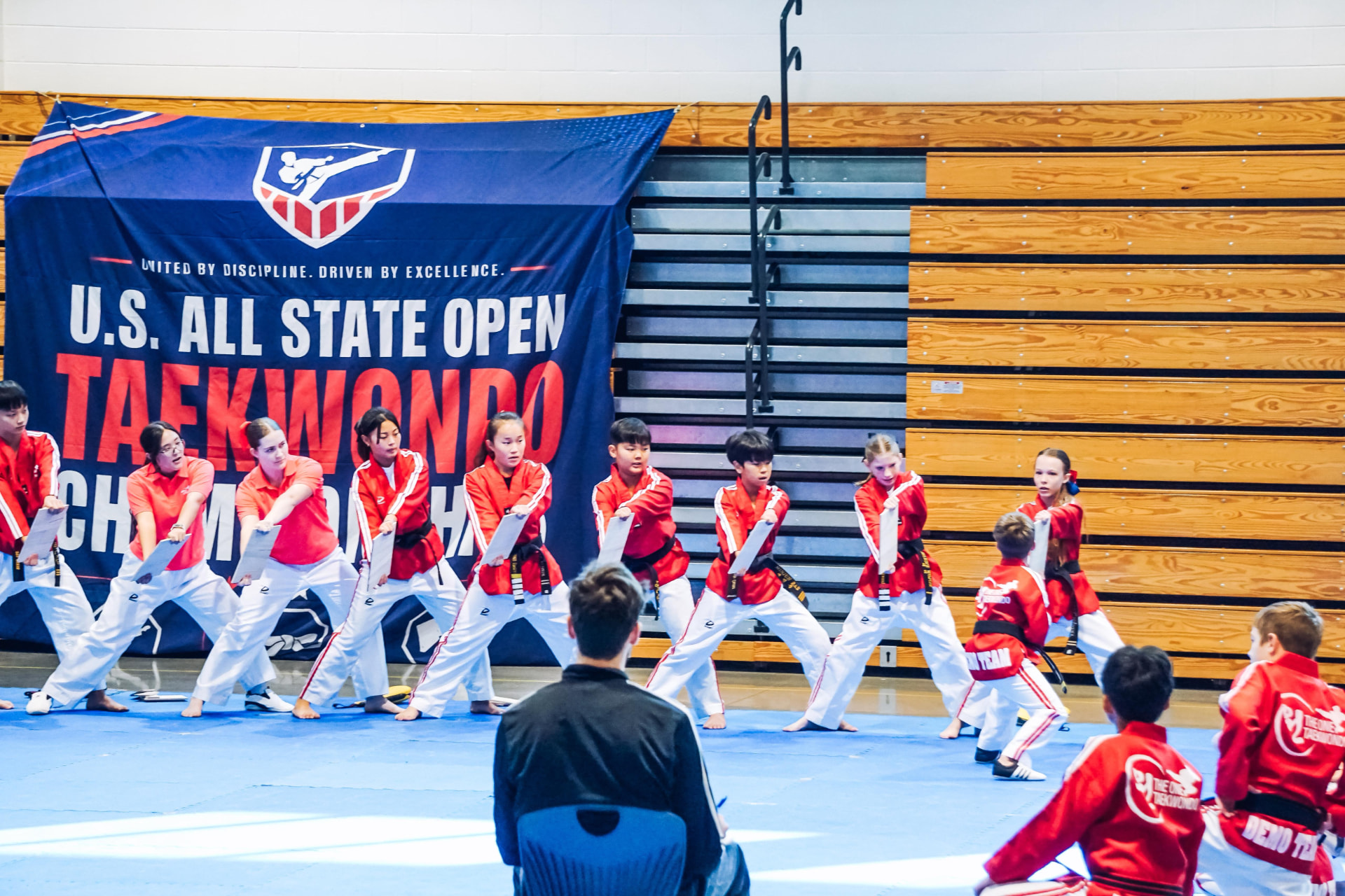 Team breaking demonstration in front of the championship banner