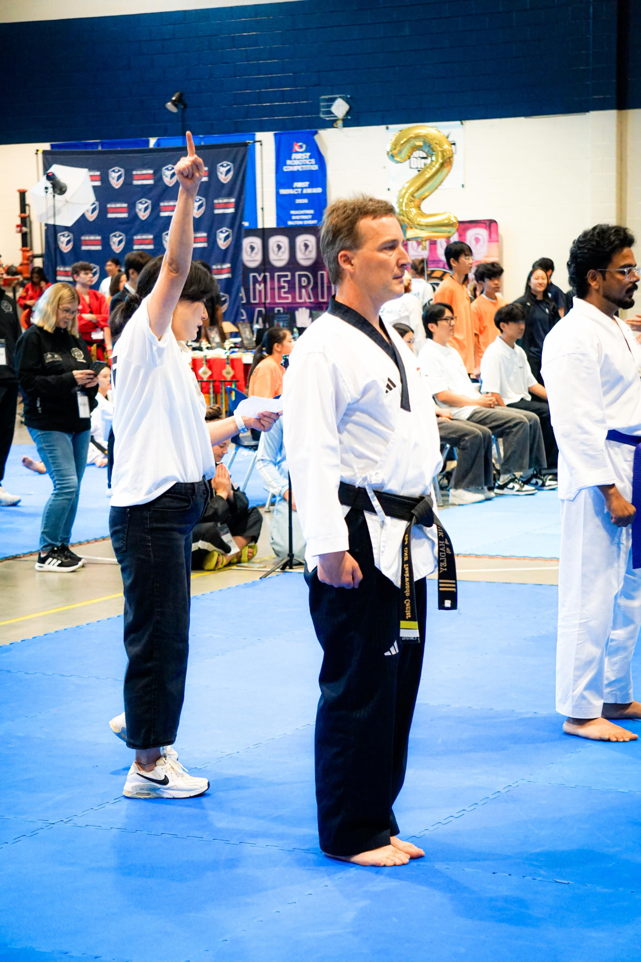 Judge signaling a score during the forms competition