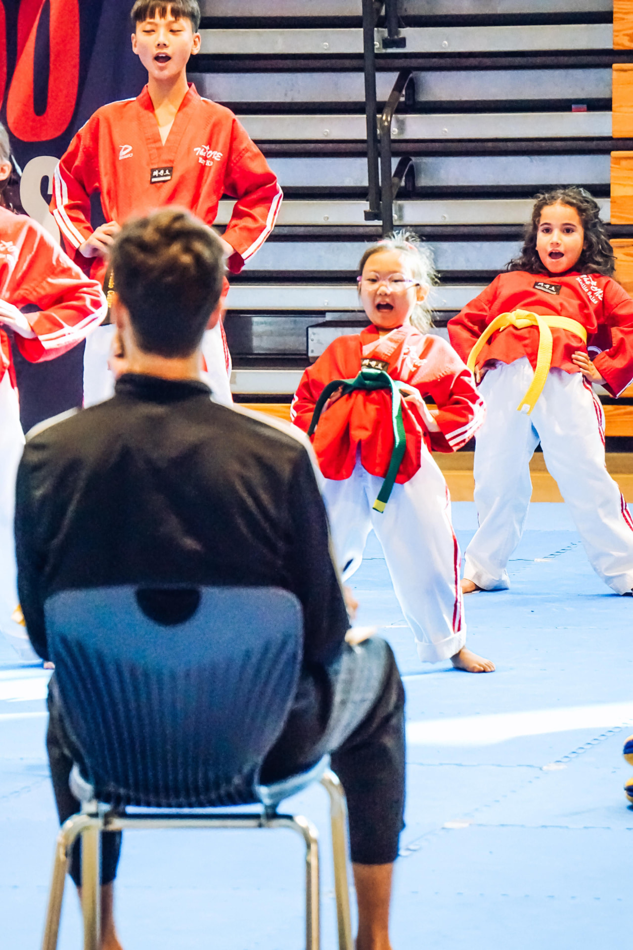 Young students performing poomsae for the judges