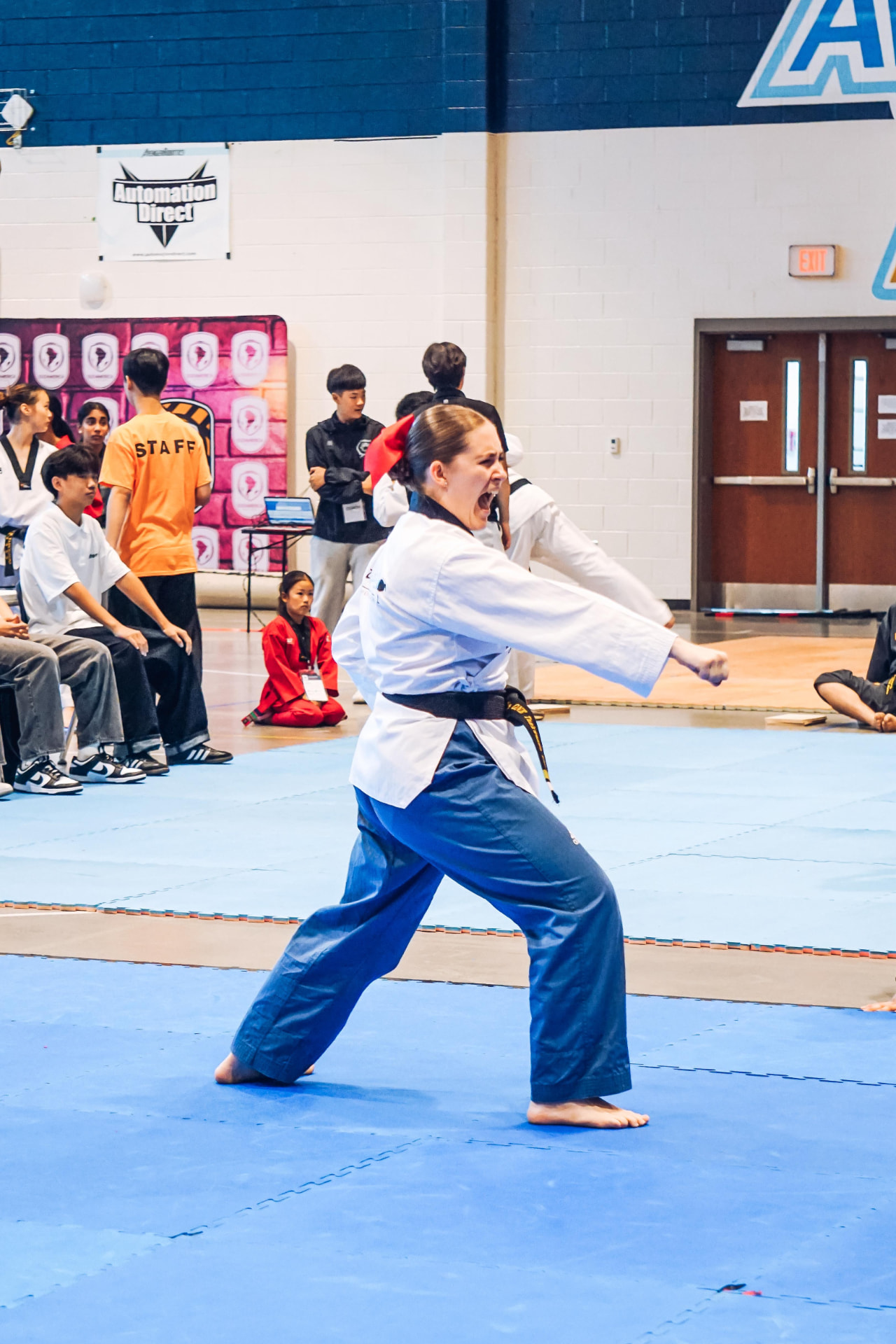 Black belt competitor performing poomsae at the championship