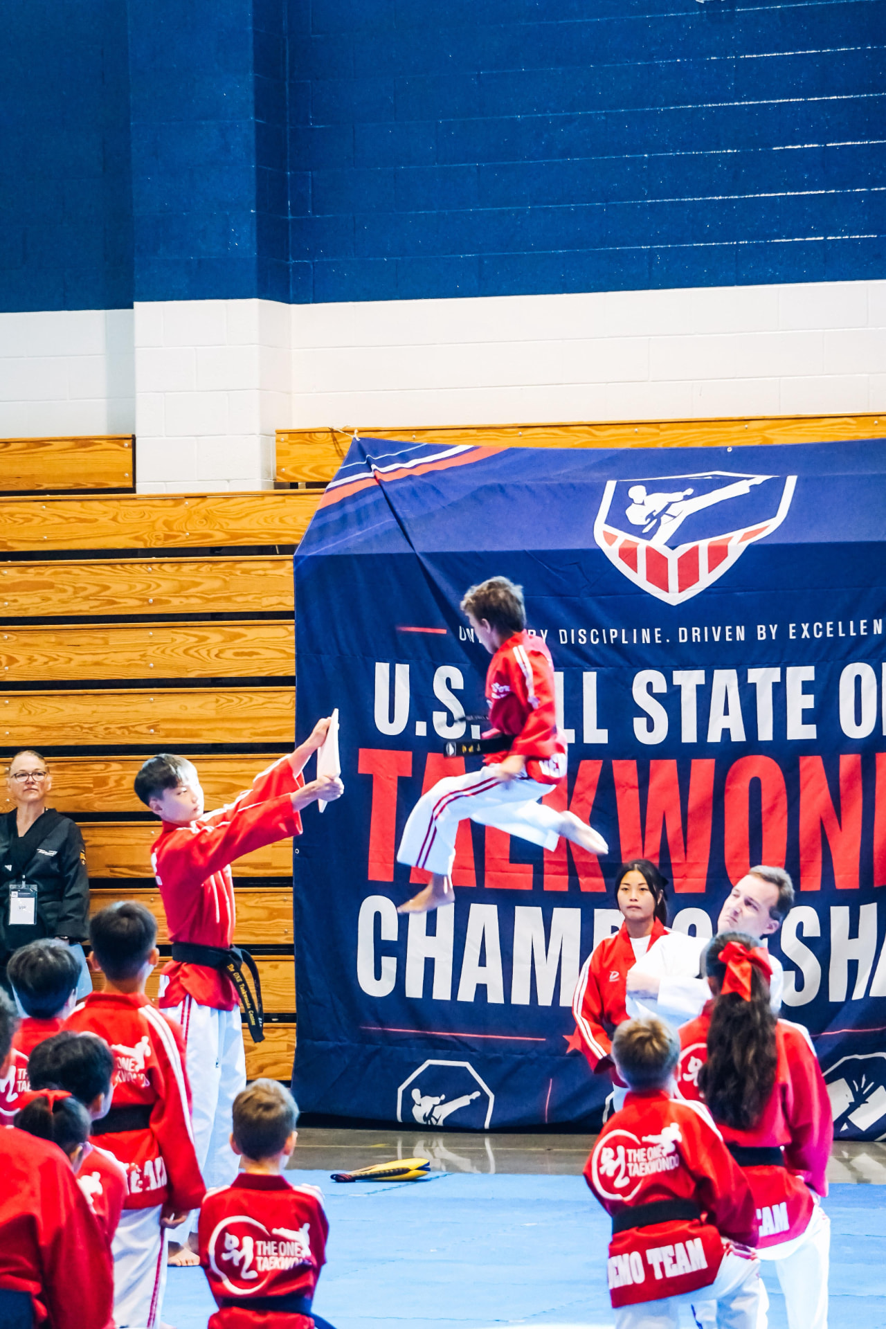 Flying kick board break during the demo team performance