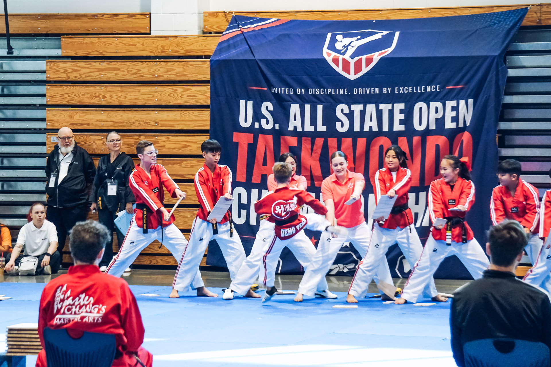 Demo team board breaking in front of the championship banner